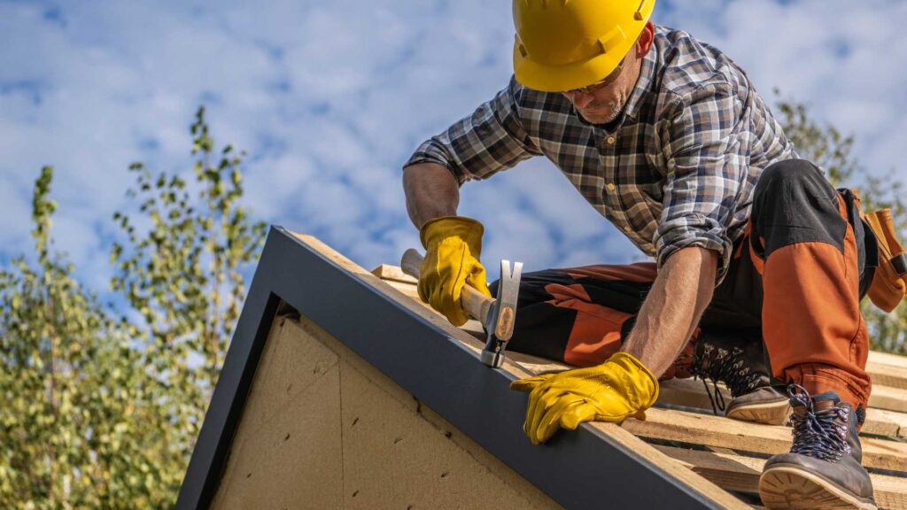 a roofer installing drip edge flashing that helps prevent deterioration