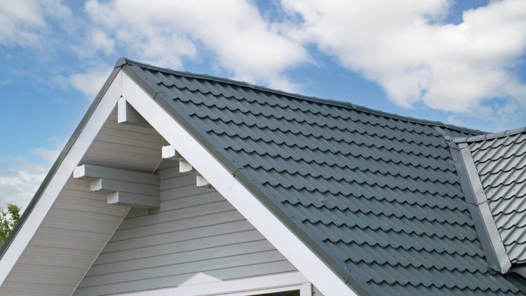 a home with a green roof edge that is drip edge flashing