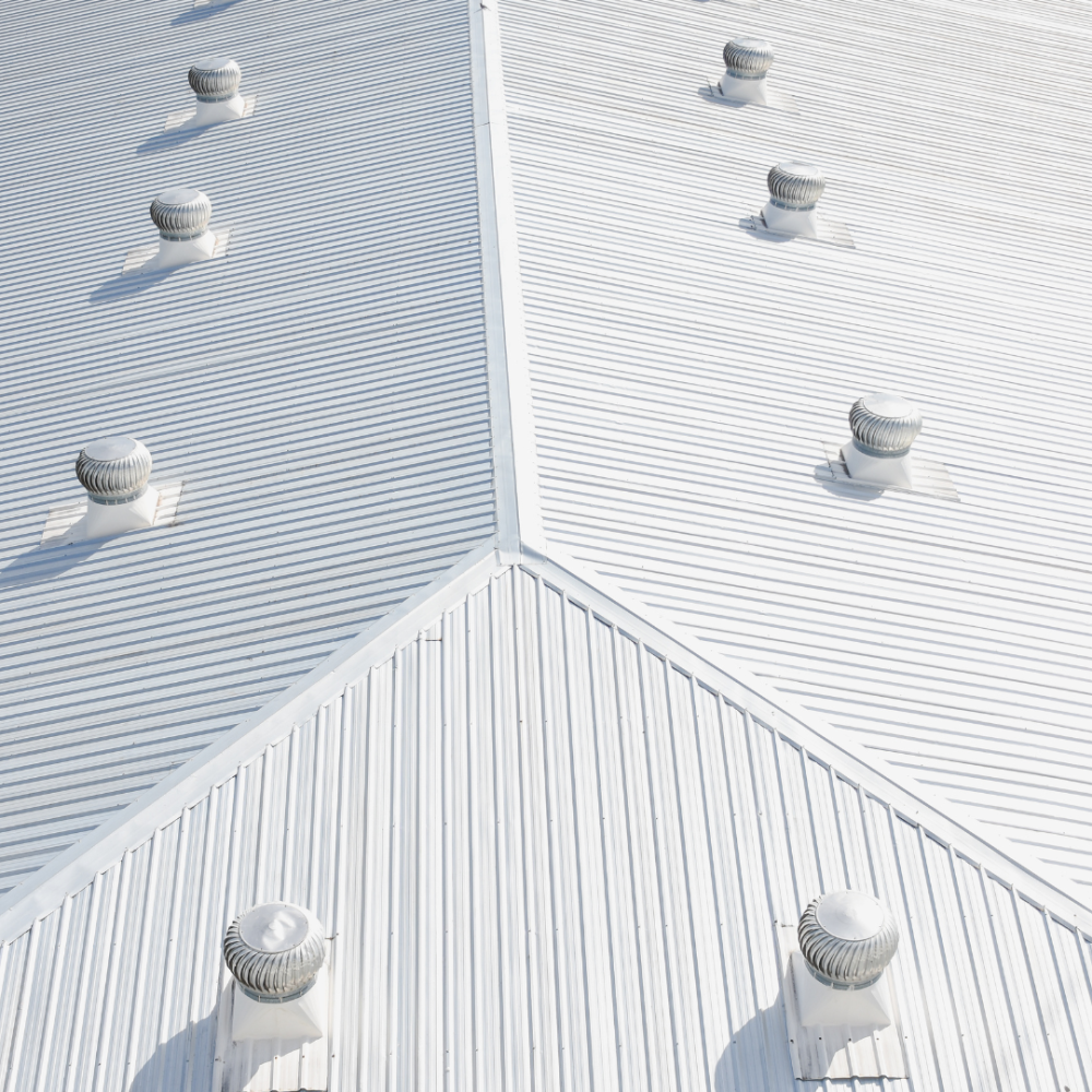 a commercial roof made of silver colored metal in mobile alabama